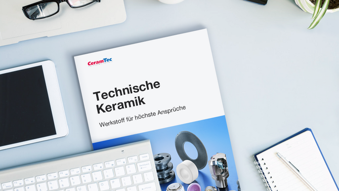 A CeramTec brochure lies on an office desk