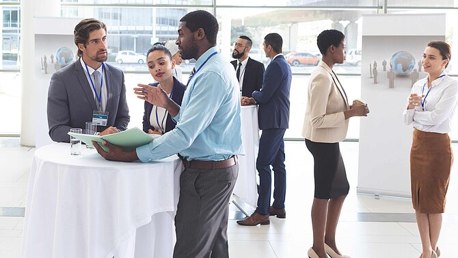 Business people discuss at a business conference