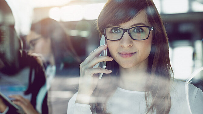 Woman smiling while talking on phone