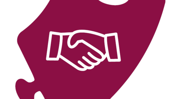 A piece of puzzle with shaking hands on it