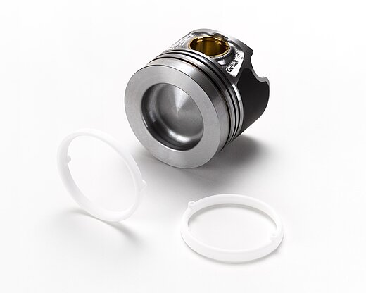 A silver metal piece and white salt cores for foundry technology