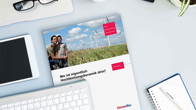 A CeramTec brochure lies on an office desk